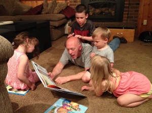 reading books with grandpa and cousins